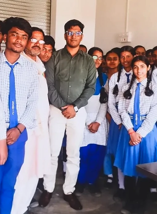 Students interacting with a guest during a school event